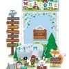 A set of welcome signs and animals in the woods.