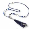A blue necklace with a tassel and beads