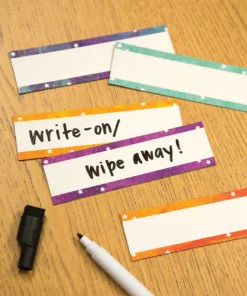 A table with four different colored paper tags.