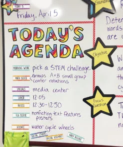 A white board with a yellow star on it