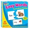A box of easy words puzzles with pictures.