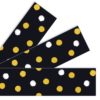 A black and white polka dot pattern with yellow dots.