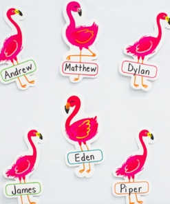 A bunch of pink flamingos with names on them