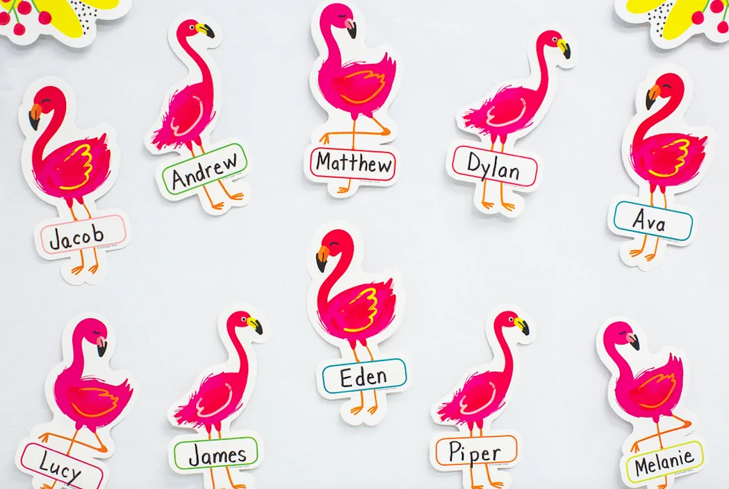 A bunch of pink flamingos with names on them