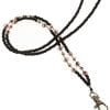 A black and white beaded lanyard with a silver clasp.