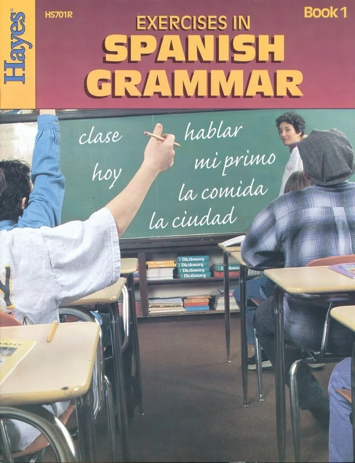 Student raising hand in Spanish class