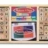 A wooden stamp set with letters and numbers.