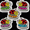 A group of five magnets that are shaped like lady bugs.