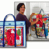 A woman holding onto two bags of fabric