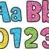 A set of colorful letters and numbers with sprinkles.