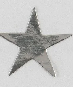A silver star is sitting on top of the floor.