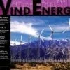 A poster of wind energy with mountains in the background.
