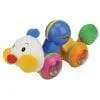 A toy is laying on its side and has colorful wheels.