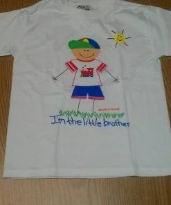 A t-shirt with an image of a boy and the words " i 'm the ville brother ".