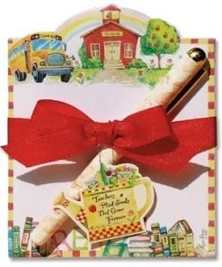 A red bow is on the back of a card.