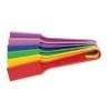 A bunch of colorful plastic spatulas are laying on top of each other.