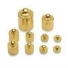 A group of gold colored weights sitting on top of each other.