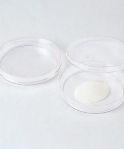 A white table with three clear plastic plates.