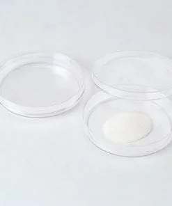 A white table with three clear plastic plates.