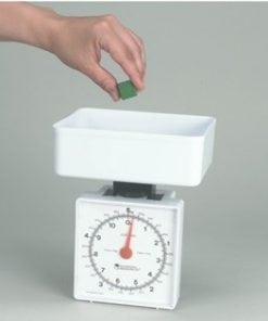 A person is putting something in the scale.