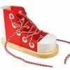 A red sneaker with laces tied to it.