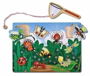 A wooden puzzle with bugs and insects on it.
