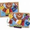 Two wooden puzzles with a bear holding clothes.