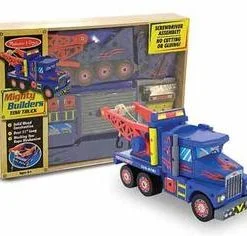 A toy truck is in its box next to the package.