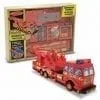 A toy fire truck in its box with the lid open.