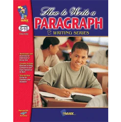 A boy writing on paper in front of a bunch of other people.