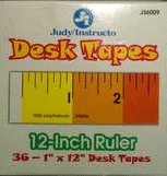 A box of desk tapes with the ruler on it.