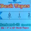 A package of desk tapes with numbers 0-1 0 in spanish.