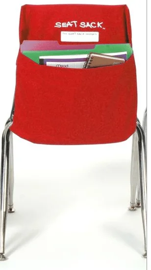 A red chair with a bag on the back of it
