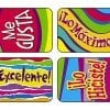 A set of four colorful magnets with spanish words.