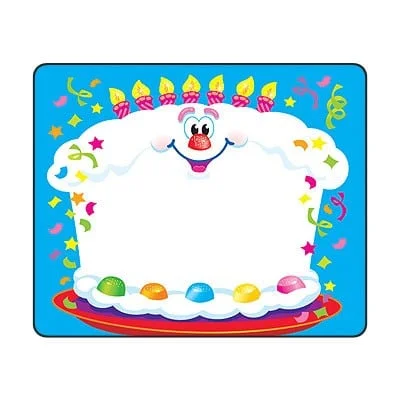 A birthday cake with candles and a face on it.