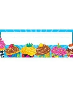 A table topper with cupcakes and other desserts.