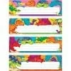 A set of four colorful dinosaur themed name plates.