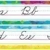 A set of four different colored pencils with the letters in cursive.