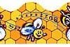 A bee is sitting on the honeycomb of a beehive.
