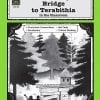 A book cover with trees and buildings in the background.