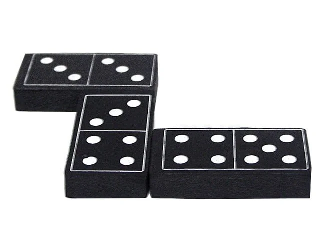 A black and white domino set on top of a table.