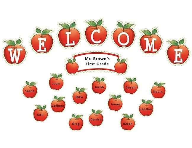 A welcome sign with apples and names of students.