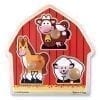 A wooden barn with animals on it