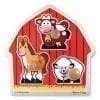 A wooden barn with animals on it