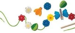 A flower and bee garland with flowers, leaves and bees.