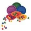 A group of bowls and plastic bears in different colors.