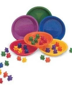 A group of bowls and plastic bears in different colors.