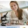 A woman sitting at a table with a laptop.