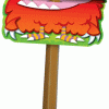 A wooden stick with an orange monster on it.