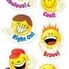 A bunch of smiley faces that are on the wall